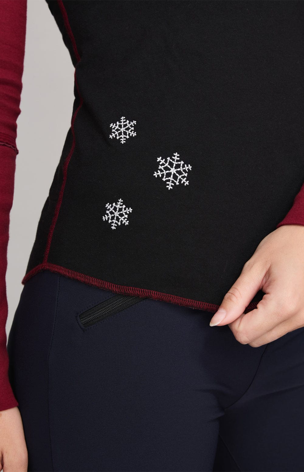 Heritage Apres Crew by Alp N Rock, Women's Black Long Sleeve Shirt with Red Sleeves and Ski Patches on the Arm and Back