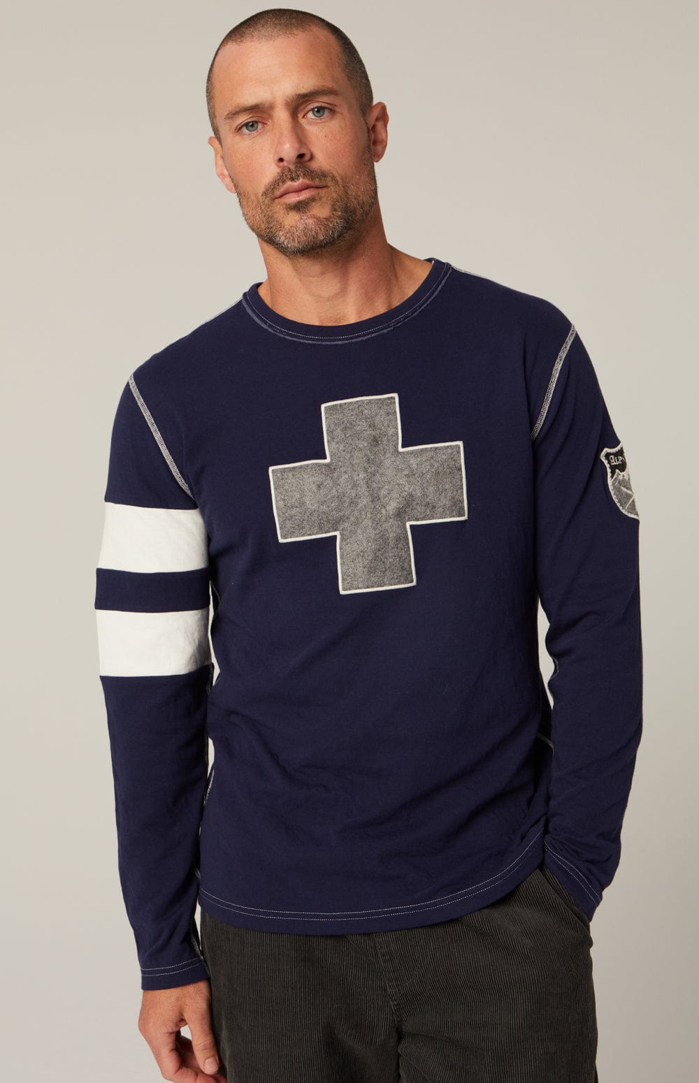 Helvetica Men's Crew by Alp N Rock, Men's Navy Shirt with White Stripes on the Arm and Grey Cross on Chest