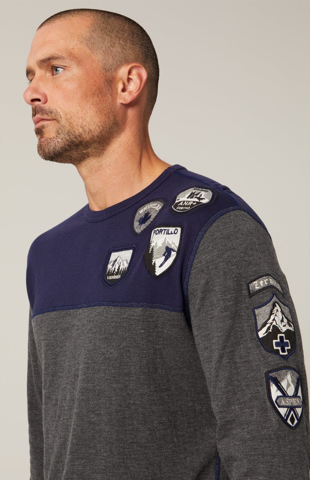 Ski Patch Crew by Alp N Rock, Men's Grey and Blue Ski Shirt with European Ski Resort Patches on Chest, Arm, and Back