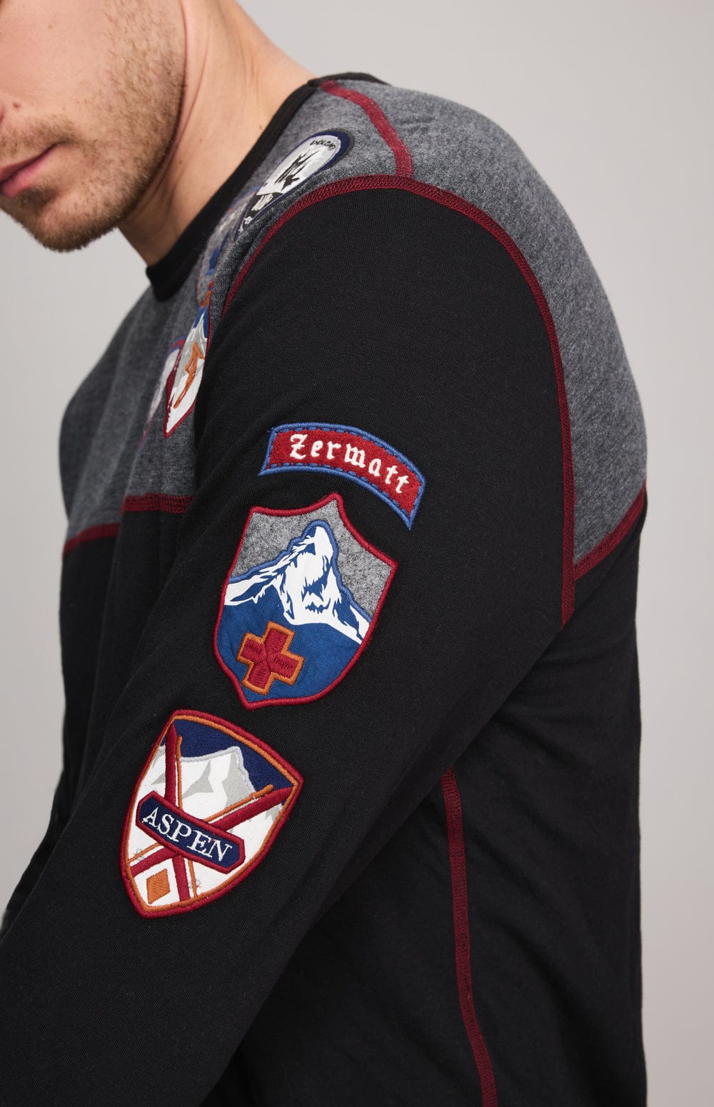 Ski Patch Crew by Alp N Rock, Men's Black and Grey Ski Shirt with European Ski Resort Patches on Chest, Arm, and Back