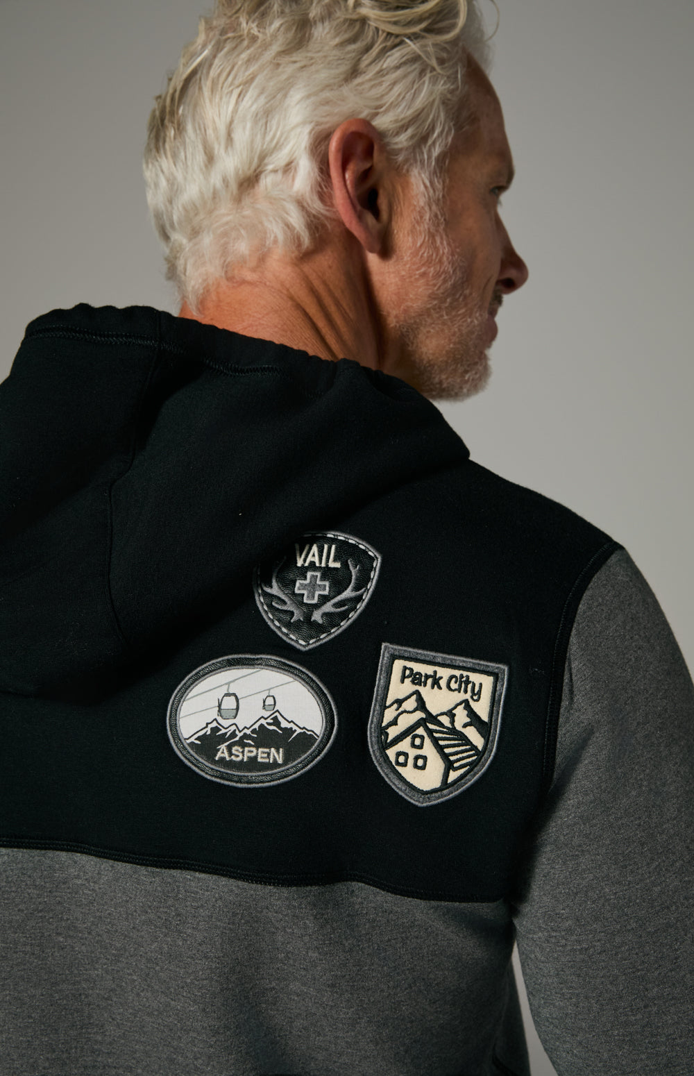 Alp N Rock Marco Hoodie, black and heather grey hoodie for men with ski resort patches on the chest and sleeves