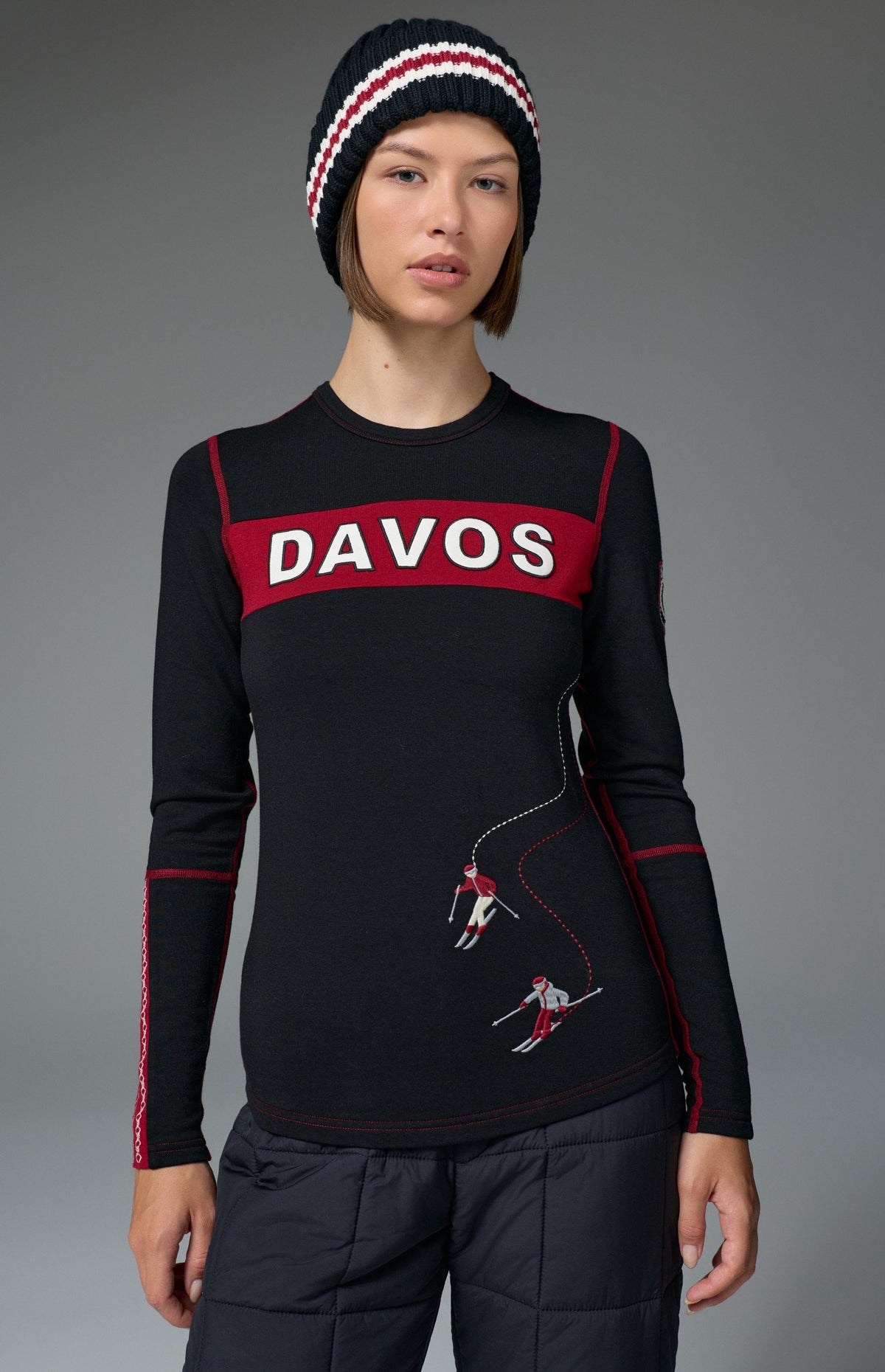 Alp N Rock Davos Ski Crew, black longsleeve ski crew with red Davos lettering on chest and embroidered skiers