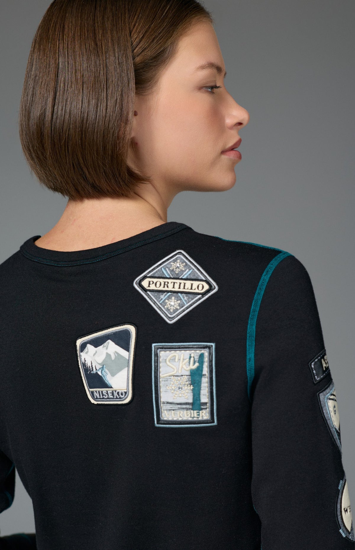 Alp N Rock Jet Setter Crew, women's black and blue ski longsleeve with embroidered patches all over