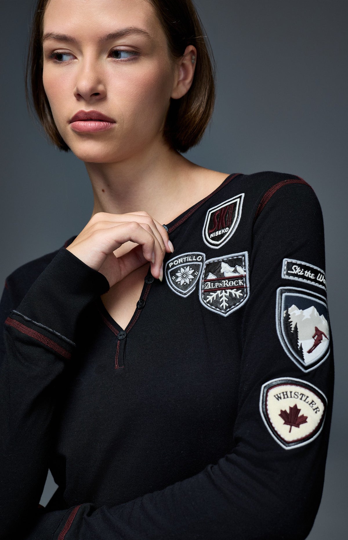 Alp N Rock Ski The World Henley Shirt, women's black henley shirt with embroidered ski patches all over