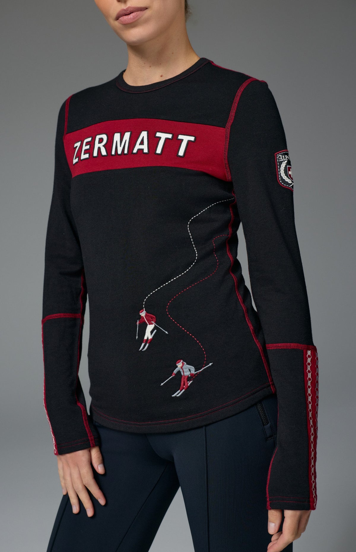 Alp N Rock Zermatt Ski Crew, women's black and red longsleeve ski crew with embroidered skiers and Zermatt lettering on chest