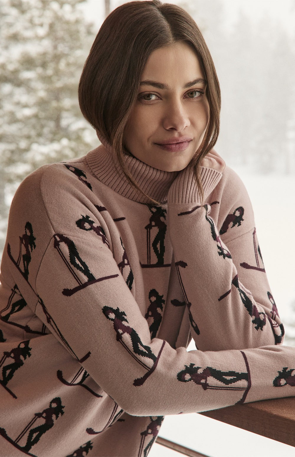 Alp N Rock Nala Sweater, pink turtleneck ski sweater for women with dark brown skier pattern all over