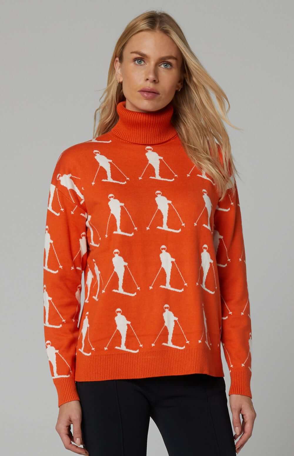 Dani Vintage Ski Sweater by Alp N Rock, Women's Tangerine Turtleneck Ski Sweater With White Skier Pattern