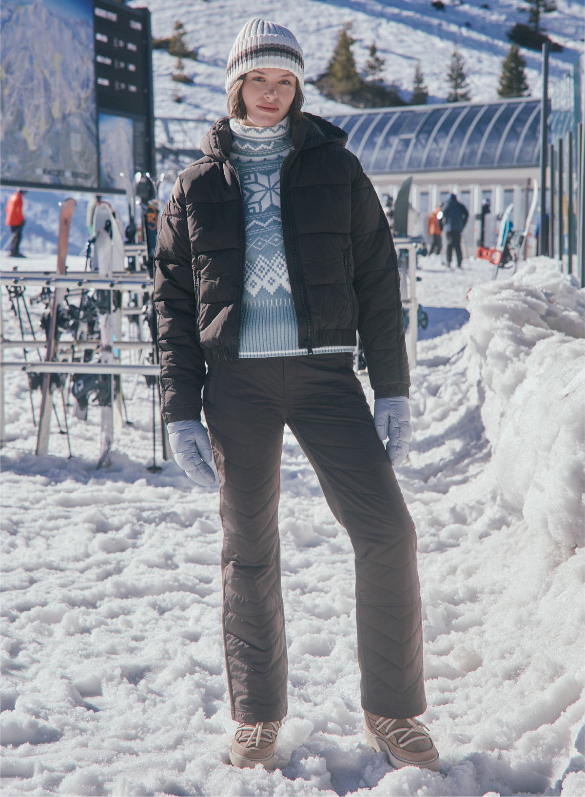 Alp N Rock women's light blue turtleneck  with white fair isle pattern and hooded dark brown puffer jacket