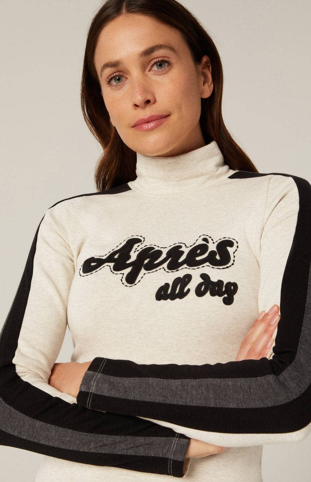 Apres All Day Mockneck by Alp N Rock, Women's Cream Long Sleeve Shirt with Black and Grey Stripes Down the Arms and Apres Lettering on Chest