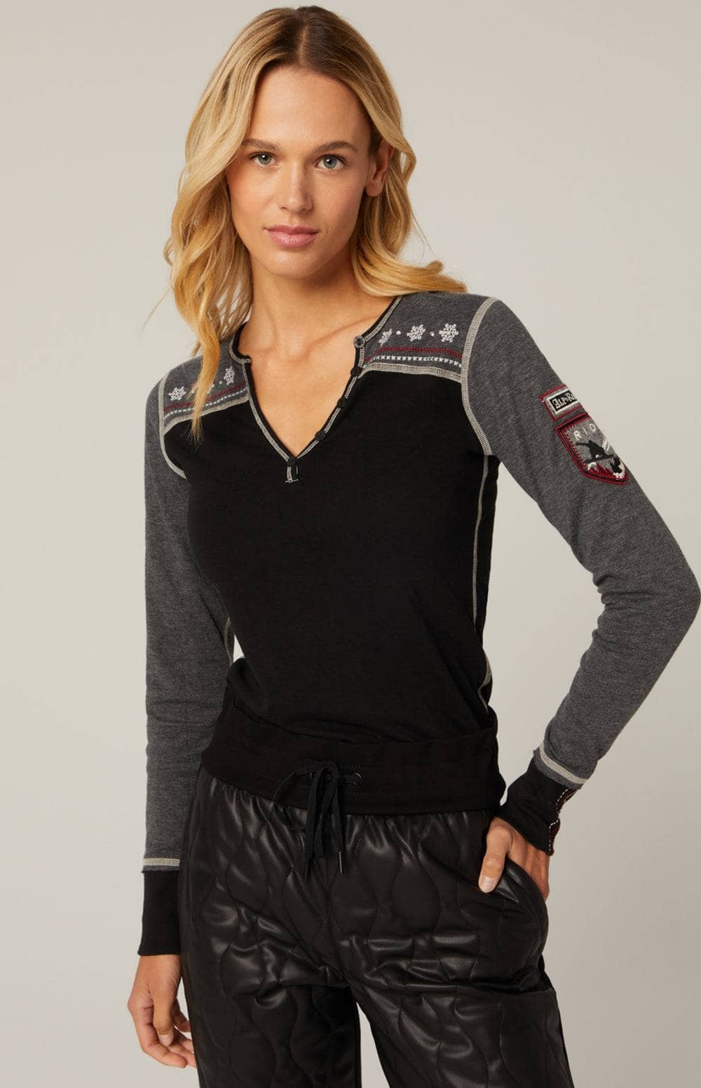 Gigi Henley by Alp N Rock, Women's Black Henley Shirt with Grey Sleeves and Embroidered Ski Design on Back