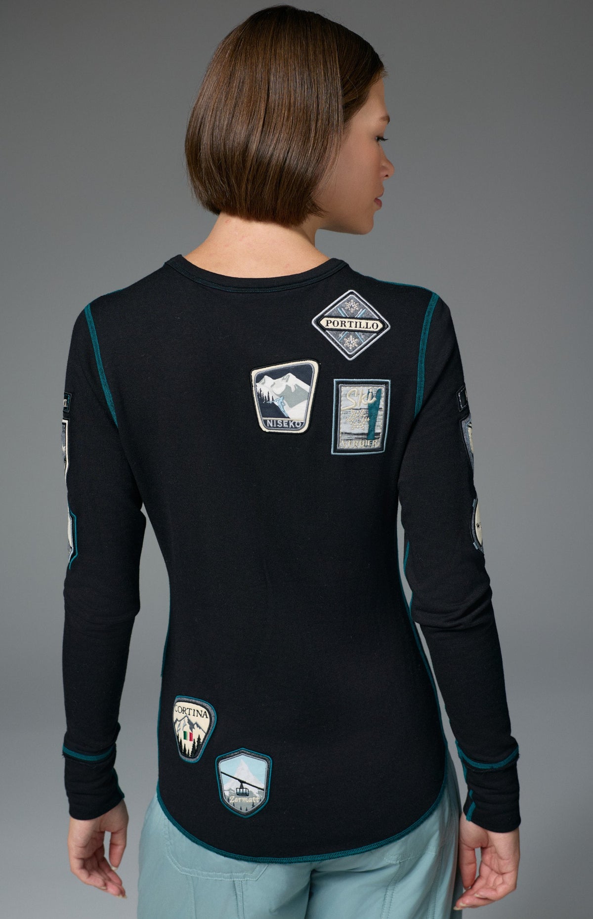 Alp N Rock Jet Setter Crew, women's black and blue ski longsleeve with embroidered patches all over