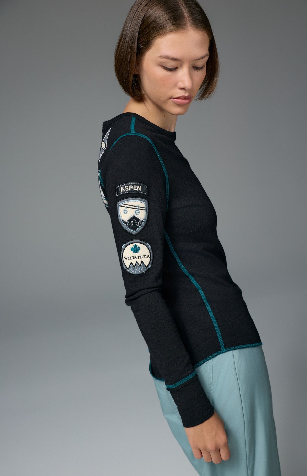 Alp N Rock Jet Setter Crew, women's black and blue ski longsleeve with embroidered patches all over