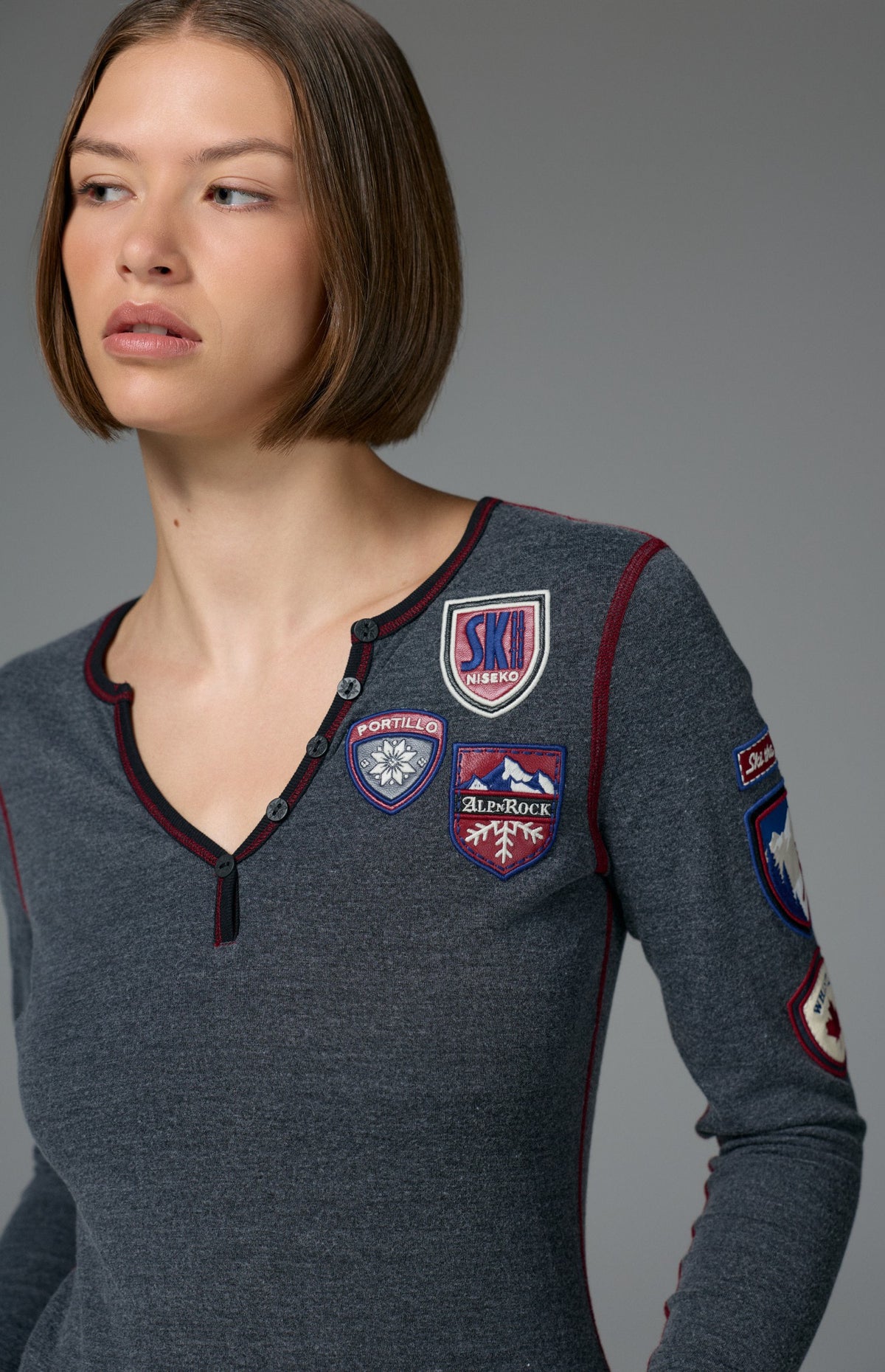 Alp N Rock Ski The World Henley Shirt, women's black henley shirt with embroidered ski patches all over