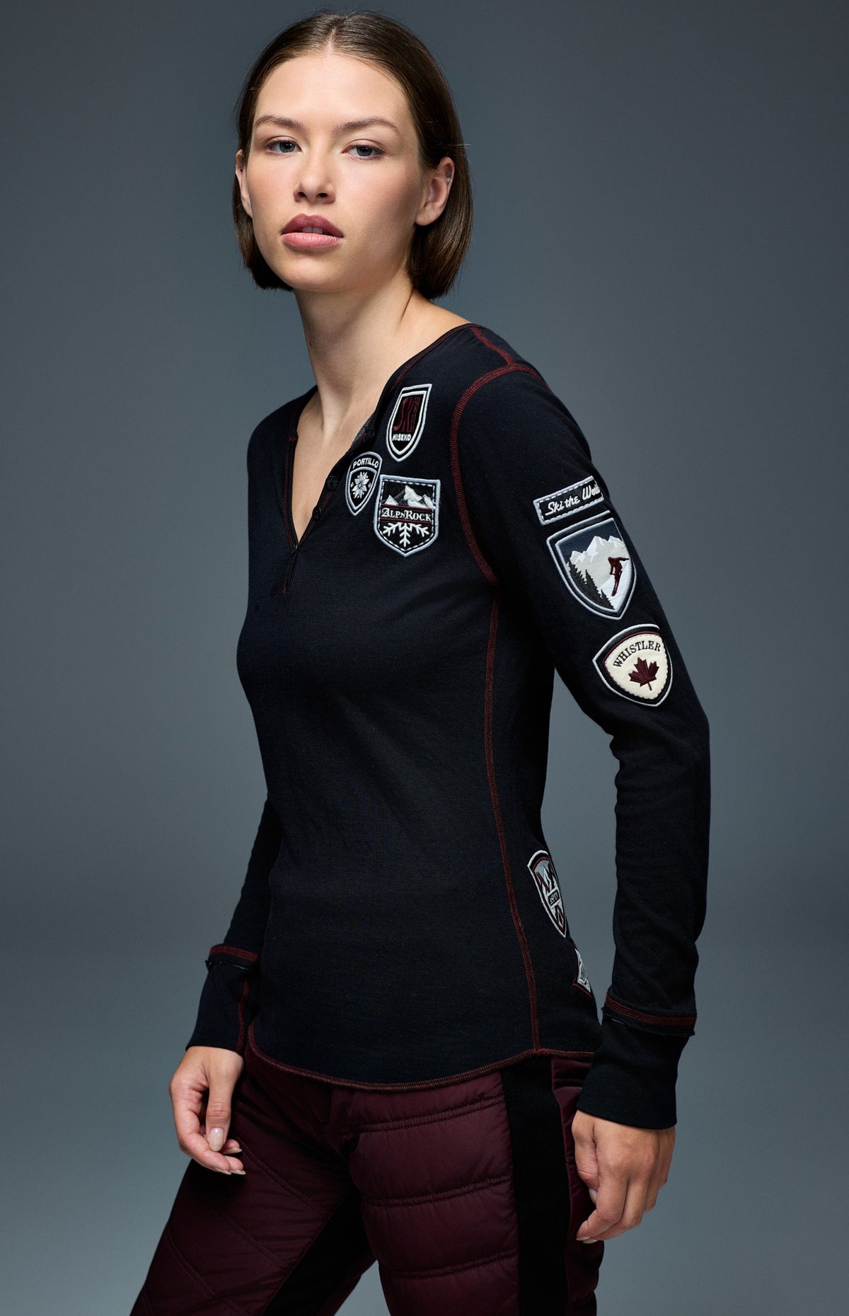 Alp N Rock Ski The World Henley Shirt, women's black henley shirt with embroidered ski patches all over