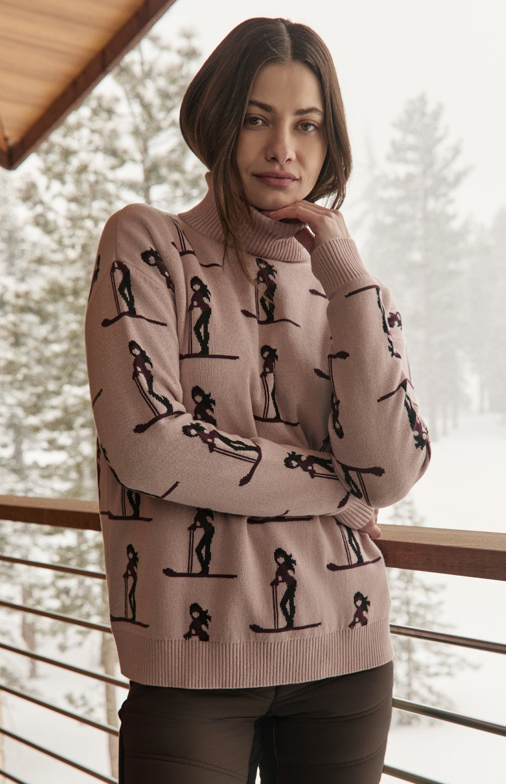 Alp N Rock Nala Sweater, pink turtleneck ski sweater for women with dark brown skier pattern all over